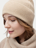Unisex Organic Cashmere Rib Knit Beanie Beige worn by model, detail view on white background #color_beige