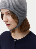 Unisex Cashmere Knitted Aviator Cap Dim Gray worn by model, detail view on white background #color_gray