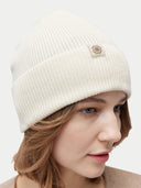 Unisex Cashmere Cashmere Rib Knit Beanie White worn by model, detail view on white background #color_white