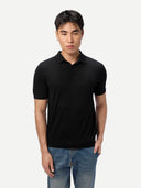 Men Classic Polo Shirt with Short Sleeve Black worn by model, detail view on white background #color_graphite-black