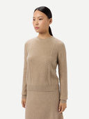 Women's Cropped Crewneck Cashmere Sweater Warm Grey worn by model, detail view on white background #color_dusty-beige
