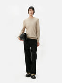 Women's Warm Grey Cashmere Crew Neck Sweater worn by model, front view on white background #color_soft-beige