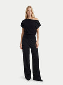 Women's Black Cashmere Asymmetrical Top worn by model, front view on white background #color_black