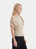 Women's Beige Cashmere Asymmetrical Top worn by model, side view on white background #color_beige