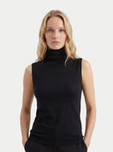 Women's Black Cashmere Silk High-Neck Top worn by model, detail view on white background #color_graphite-black