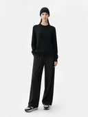Person wearing a black outfit on a white background #color_black #ai-image