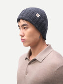 Unisex Beanie Charcoal worn by model side view on white background #color_charcoal