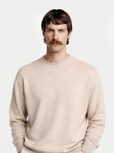 Men's Beige Cashmere Colour Crewneck Sweater worn by model, detail view on white background #color_beige #ai-image