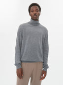 Men's Dim Gray Cashmere Turtleneck Sweater worn by model, detail view on white background #color_gray