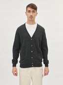 A man wearing a gray V-neck cashmere cardigan with a round neckline and front button details. #color_charcoal