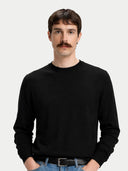 Men's Cashmere Silk C-Neck Sweater Black worn by model, detail view on white background #color_graphite-black #ai-image