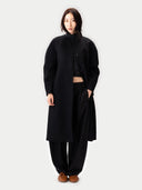 Oval-Sleeve Cashmere Coat Black worn by model, detail view, on white background #color_black