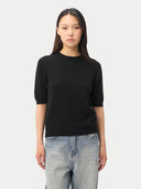 Women's Cashmere Elbow-Length Sleeve Cashmere Sweater Black worn by model, detail view on white background #color_black