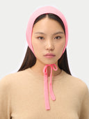 Pink Cashmere Bonnet For Woman worn by model front view on white background #color_shell-pink