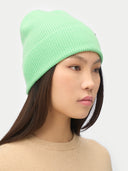 Green Ash Cashmere Rib Knit Beanie worn by model, detail view on white background #color_soft-green