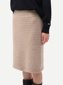 A taupe knit cashmere sweater skirt with a textured open-knit pattern, shown flat against a light gray background. #color_dusty-beige
