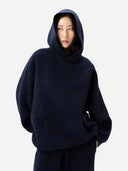 Unisex Inida Ink Cashmere Sweatshirt worn by model, detail view on white background #color_ink-blue