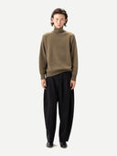 Barrel-Leg Cashmere Pants Black worn by model, front view on white background #color_black