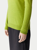 Women's Spinach Green Cashmere Crewneck Sweater worn by model, detail view on white background #color_lime-green