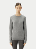 Women's Grey Cashmere Essential Crew Neck Sweater worn by model, detail view on white background #color_urban-silver