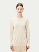Women's White Cashmere Basic Crew Neck Sweater worn by model, detail view on white background #color_off-white