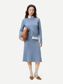 Women's Dusty Blue A-Line Cashmere Knitted Skirt worn by model, front view on white background #color_deep-dusty