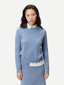 Women's Cropped Crewneck Cashmere Sweater Dusty Blue worn by model, detail view on white background #color_deep-dusty