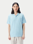 Man wearing a light blue polo shirt against a plain background #color_forget-blue