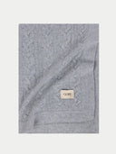 Cashmere Woven Blanket Grey detail view on white background #color_high-rise