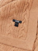 Close-up of a beige cable knit cashmere blanket with a visible 'GOBI' brand tag.
#color_sheepskin