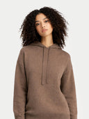 Person wearing a brown hoodie and blue jeans on a white background  #color_taupe #ai-image
