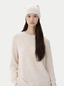Person wearing a white beanie and sweater on a white background  #color_off-white #ai-image