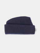 Navy blue knit beanie on a light gray background #color_navy