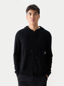 Men's Zip-Up Cashmere Hoodie Black worn by model, detail view on white background #color_black