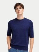 Men's Silk Cashmere Crew Neck T-Shirt worn by model, detail view on white background #color_dark-indigo #ai-image