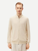 Cream-colored zip-up cashmere sweater on a light gray background #color_off-white
