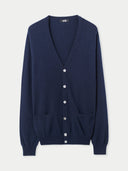 Navy blue cardigan with button details on a light gray background. #color_navy-blue