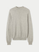 A light gray heather knit crewneck cashmere sweater with long sleeves and ribbed cuffs, displayed against a light gray background. #color_steel-silver