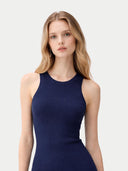 A sleeveless ribbed knit tank cashmere top in dark navy blue, shown flat against a light off-white background. #color_dark-indigo #ai-image
