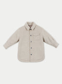 A light beige textured button-up shirt jacket with a collar, a chest pocket, and dark buttons, displayed flat against a light gray background. #color_beige