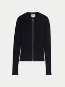 Black zip-up cardigan on a light grey background #color_black #ai-image