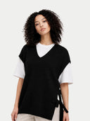 Women's V-neck Cashmere Maternity Top Black worn by model detail view on white backround #color_black #ai-image