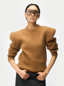 Person wearing a Sculpted-Shoulder Cashmere Sweater Camel Brown on a white background #color_warm-brown