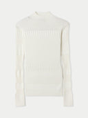 White ribbed knit cashmere sweater on a light beige background #color_pure-white