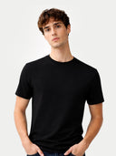 Men's Silk Cashmere Crew Neck T-Shirt Black worn by model, detail view on white background #color_graphite-black #ai-image