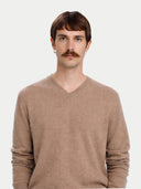 Men's Taupe Cashmere V-Neck Sweater worn by model, detail view on white background #color_taupe #ai-image