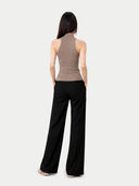 Women's Taupe Cashmere Turtleneck Top worn by model, back view on white backround #color_taupe #ai-image