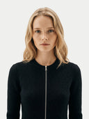 Woman wearing a black ribbed knit jumper with a zipper on a white background #color_black #ai-image