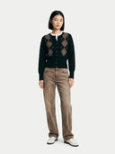 Women's Black Cashmere Argyle Cardigan worn by model, front view on white background #color_black #ai-image