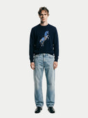Men's Navy Cashmere Horse Intarsia Sweater worn by model, front view on white background #color_navy-blue #ai-image